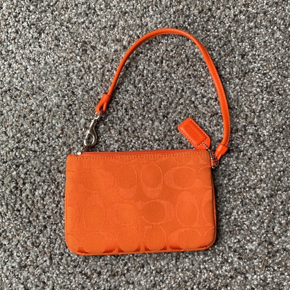 Orange Coach clutch. Like new. Other colors available. - Picture 2 of 3